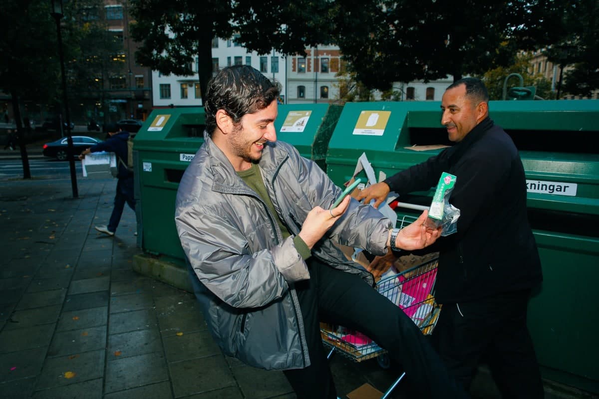 People recycling with Plovie at green bins